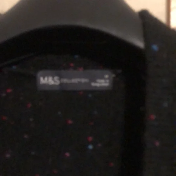 Long sweater jacket with belt.  Black with a few colored fabric spots. - Picture 4 of 7